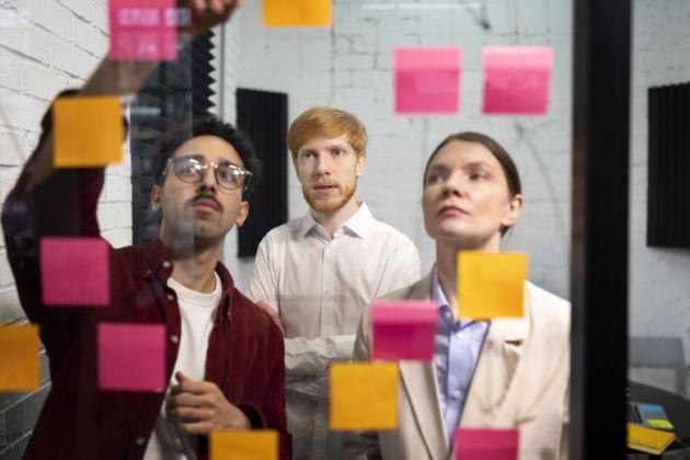 medium-shot-people-looking-post-its